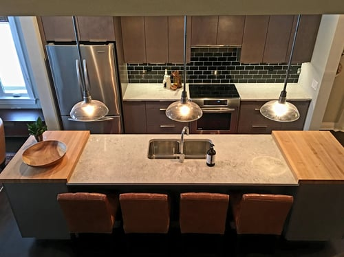 Remodeled kitchen with island and custom finishes